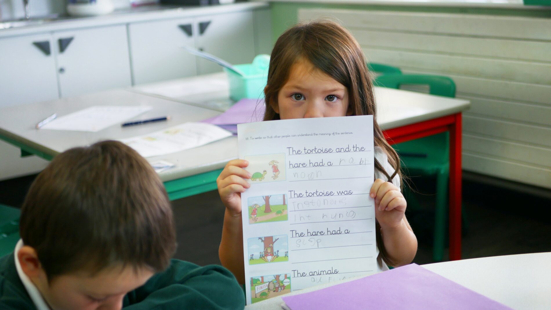P1170376 pupil showing her phonics work at halling primary school