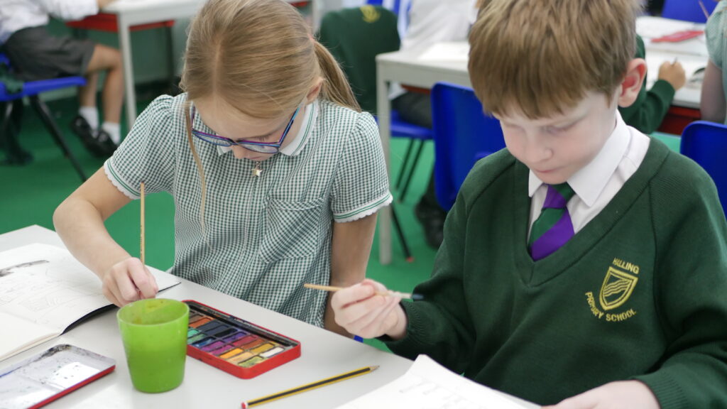 pupils painting in art and design class at halling primary school